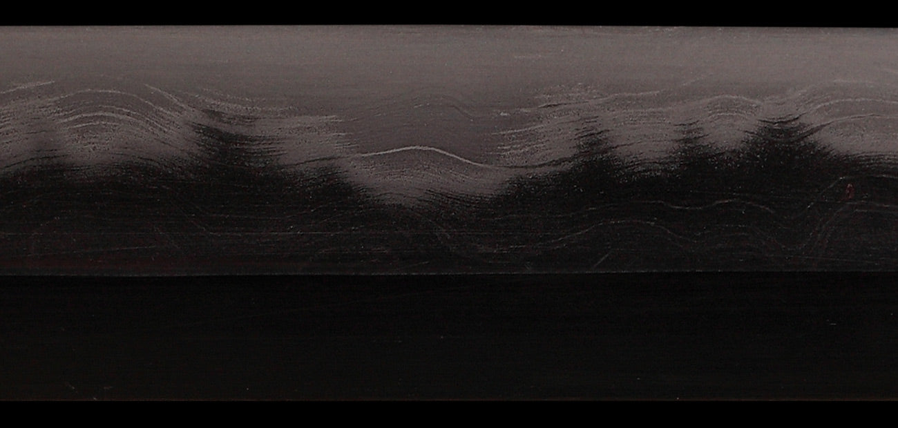 Close-up of the Sea Wave Wakizashi blade, showcasing intricate design and traditional craftsmanship.