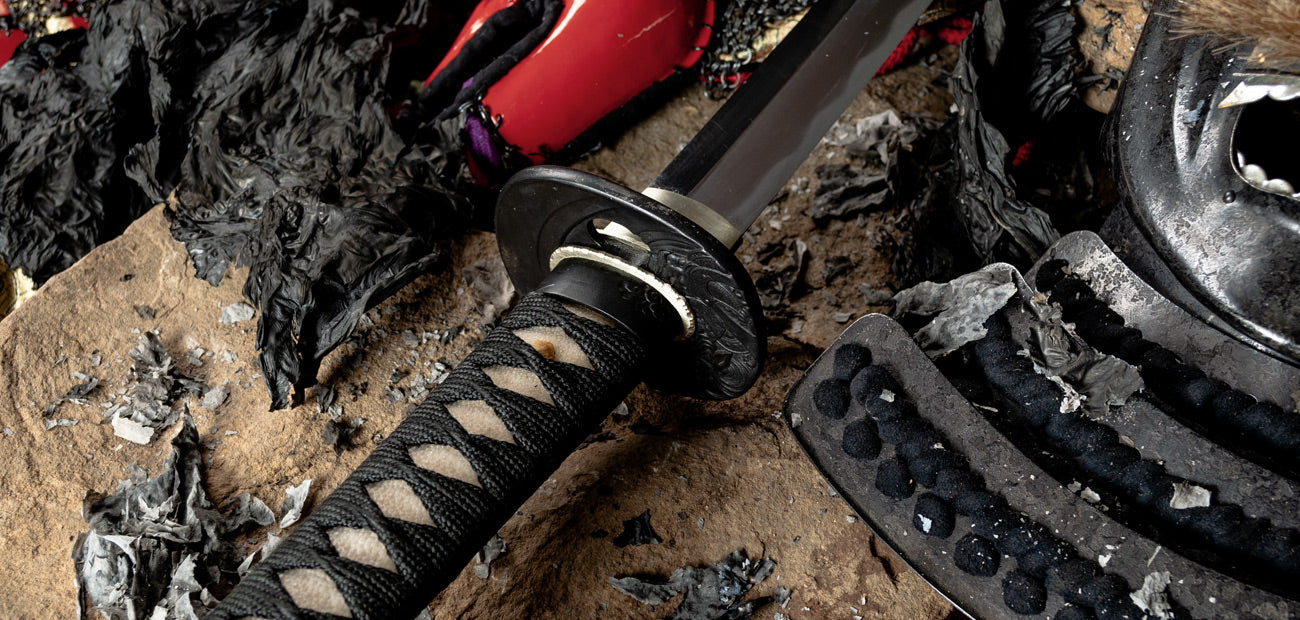 Close-up of the Warfire Katana handle and tsuba, showcasing intricate design and traditional craftsmanship.